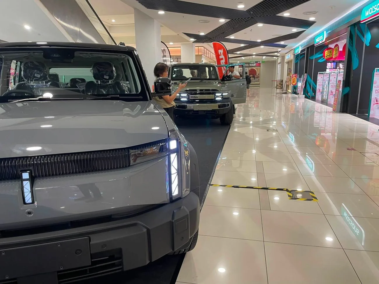Two iCAUR V23 SUVs on display inside a shopping mall in Johor